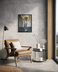 She Stands fine art print in a black frame, no mat, displayed in a modern living room — frame not included